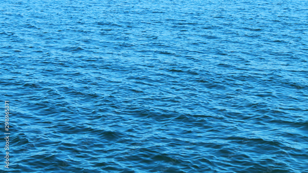 Fototapeta premium blue waves of the sea contrast without unnecessary objects texture background