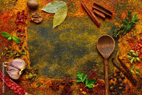 Fototapeta Naklejka Na Ścianę i Meble -  Culinary background with variety of spices. Top view with copy space.