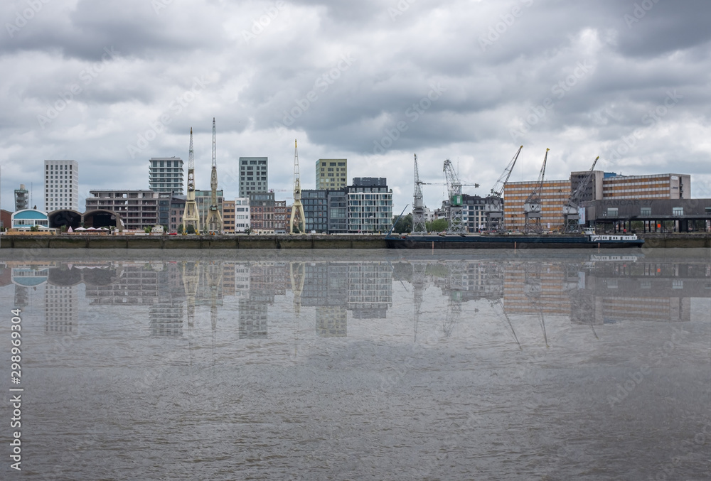 Antwerp, Belgium - 20 August 2019: Skyline of the Northern part of Antwerp, reflected