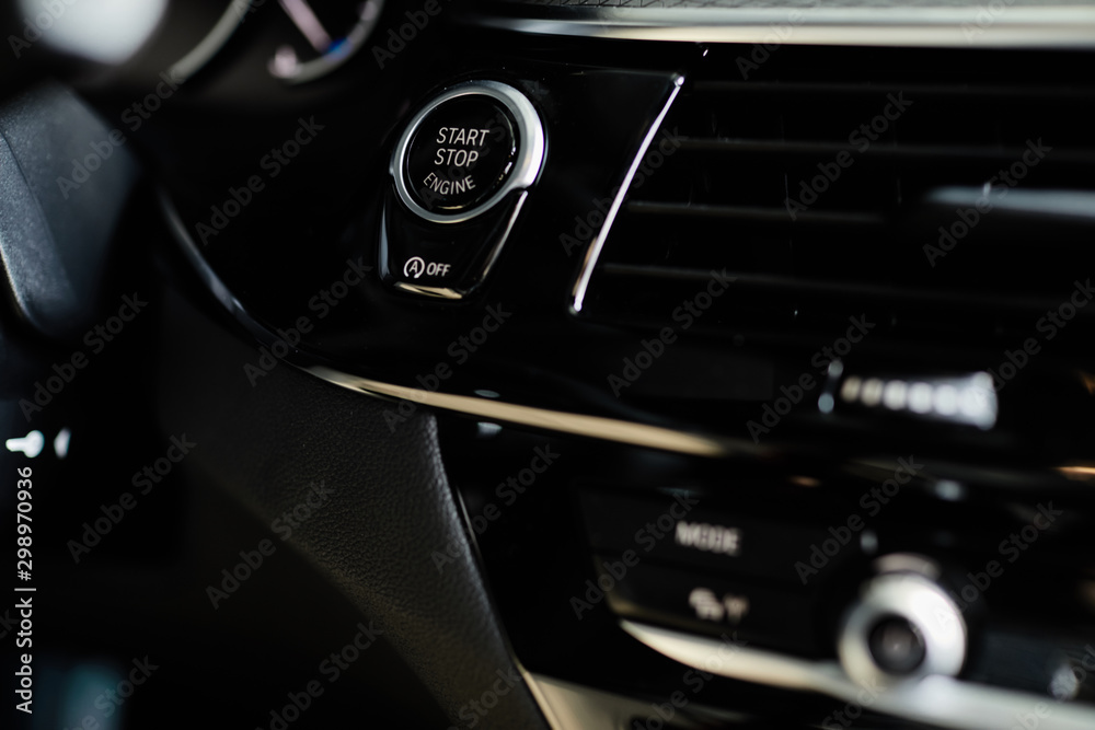 Fototapeta premium Start stop button in a car, luxury car interior concept