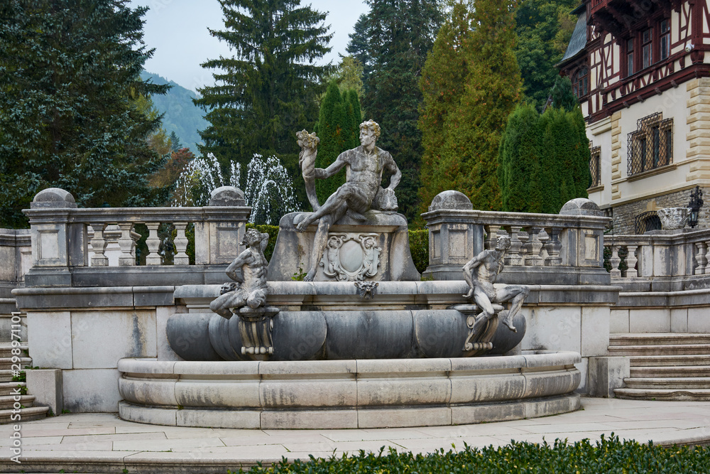Peles Castle, residence of King Charles I in Sinaia, Romania. Autumn landscape of royal palace and park.