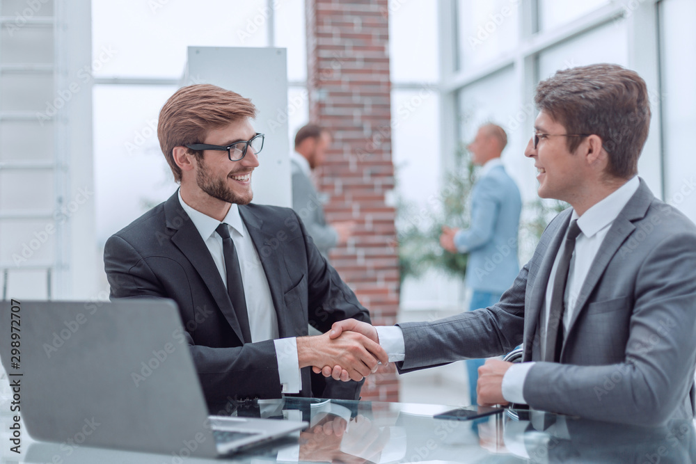 business people shaking hands during a business meeting. business people shaking hands during a business meeting.