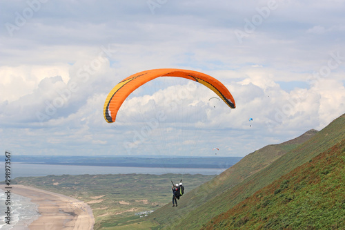 Tandem Paraglider flying above Rhossili 
