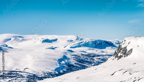 View from Swedish (Atoklinten mountain) to Norwegian side of winter mountains - feeling excited by view to beautiful mountains and northern nature. Absolutely clear blue sky, Northern Sweden Lappland © Alexandre Patchine