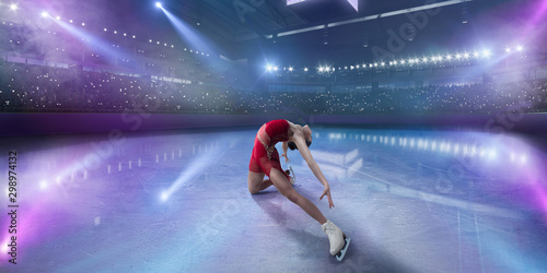 Figure skating girl in ice arena. photo