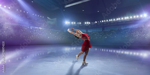 Figure skating girl in ice arena. photo