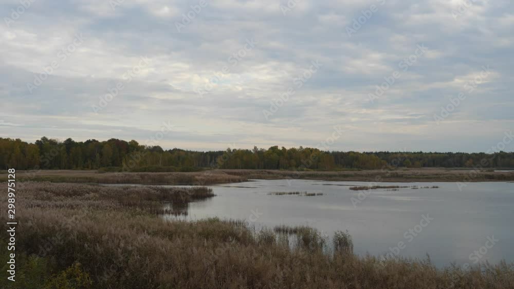 Panoramic shot of lake in park on autumn Panoramic shot of lake in park on autumn