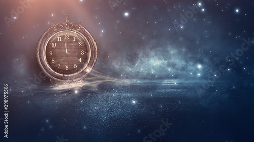 Dark abstract scene with a vintage watch. Night landscape, snow, smoke, magic fantasy with a clock.