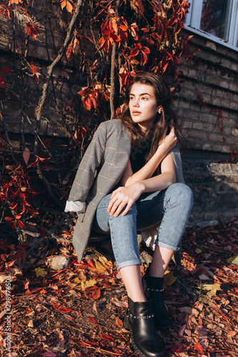 Close up portrait of young brunette stylish trendy girl outdoors in autumn park. Beauty, seasons, modeling, art, inspiration concept