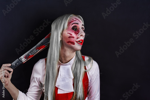 gray haired witch with green eyes on a black background for Halloween