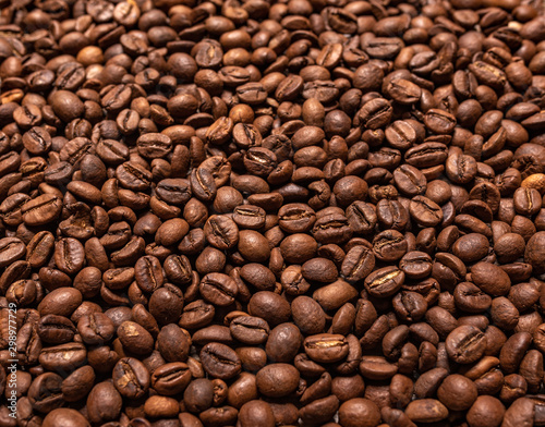 Black coffee beans closeup as a background.