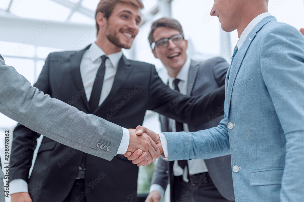 welcome handshake of business people in the office welcome handshake of business people in the office