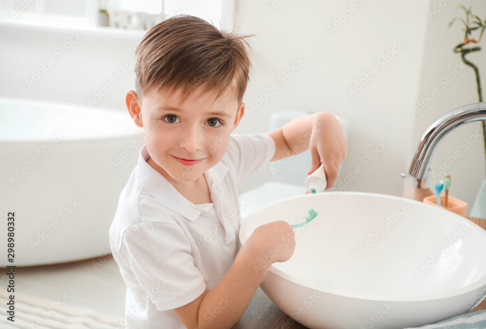 Little boy brushing teeth in bathroom Little boy brushing teeth in bathroom