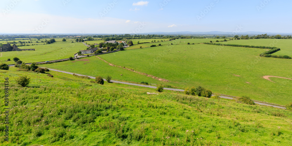 rural landscape with field and blue sky in Ireland