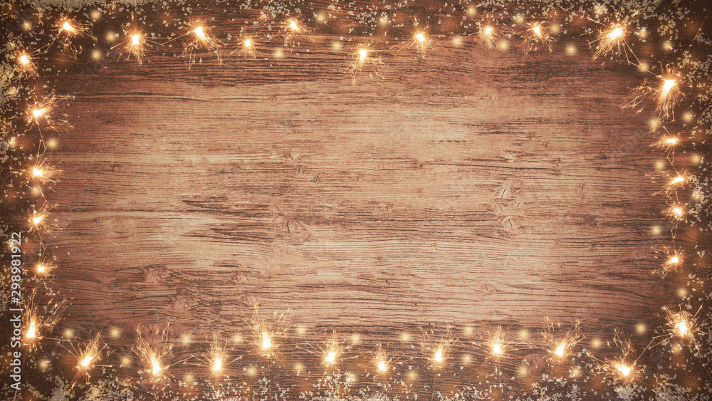 Φωτογραφία frame of lights bokeh flares and sparkler isolated on rustic brown wooden wood t