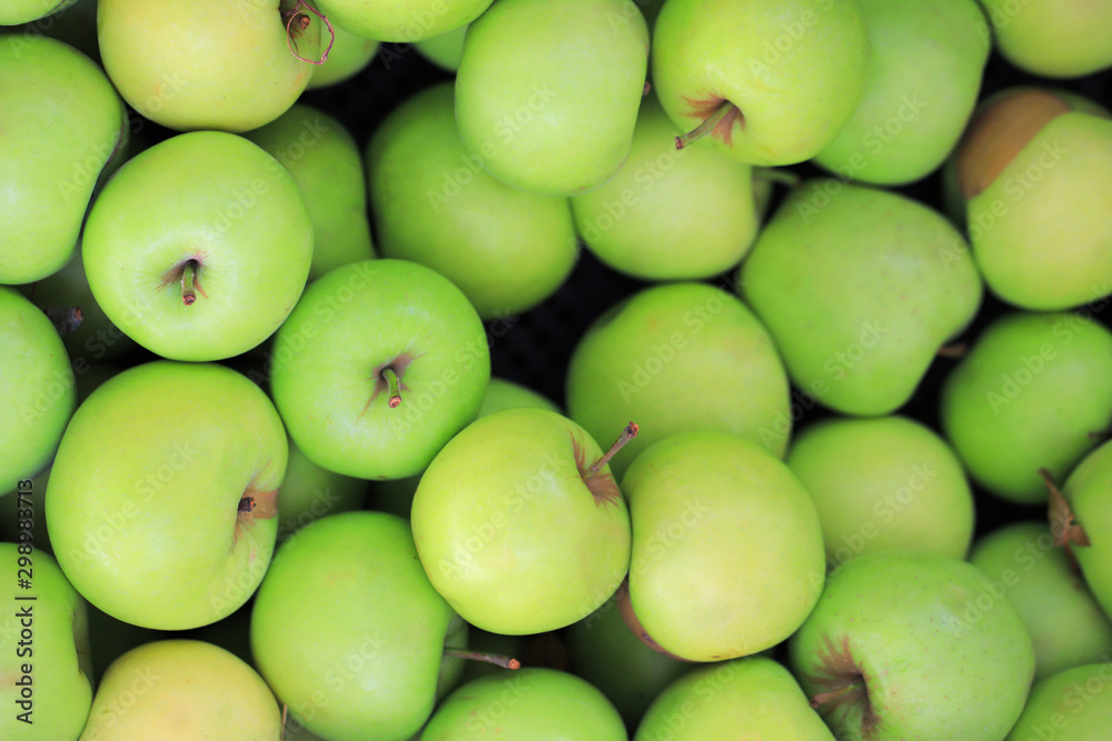 Green apples background on the market Green apples background on the market