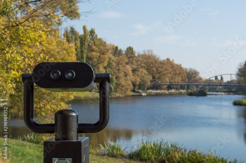 Coin operated binoculars with riverland panorama view photo