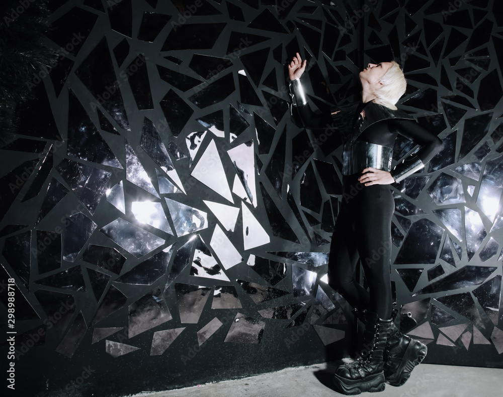 Φωτογραφία young blonde caucasian man standing in alien cosmos halloween costume and lookin