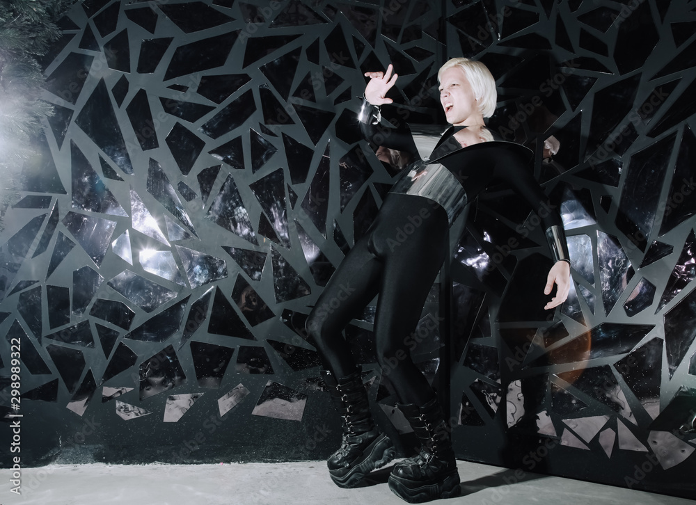 Φωτογραφία young blonde caucasian man standing in alien cosmos halloween costume and lookin