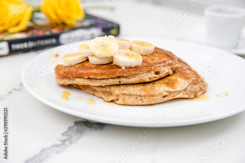 delicious banana pancakes on marble countertop