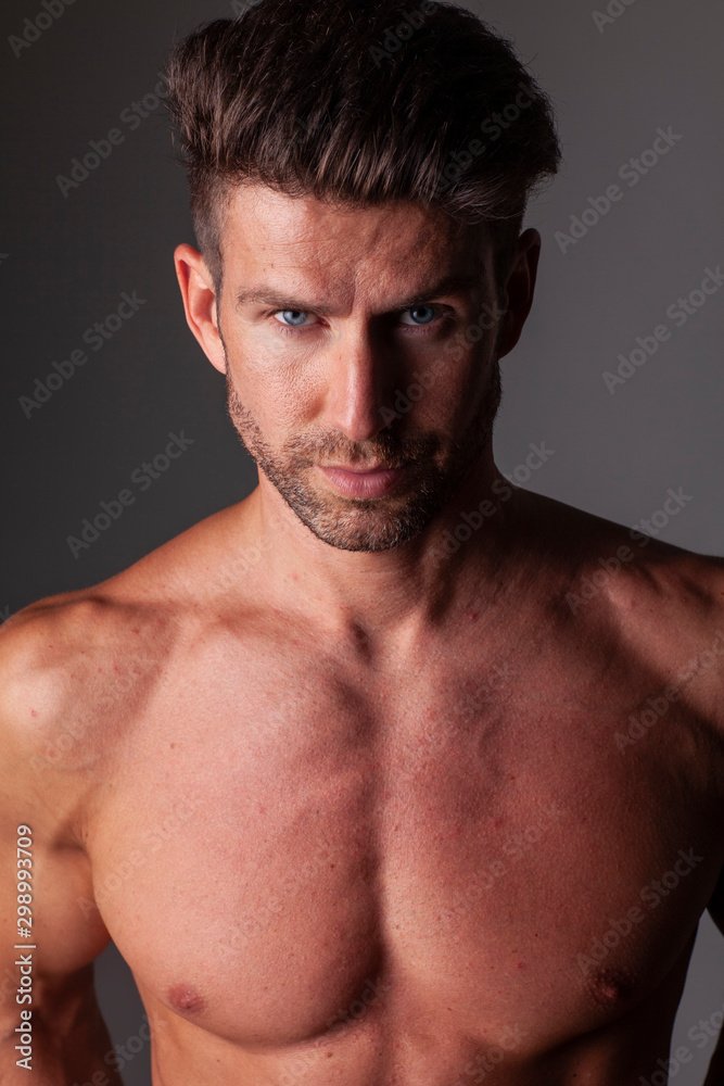 The portrait of muscular handsome model without t-shirt. The portrait of muscular handsome model without t-shirt.