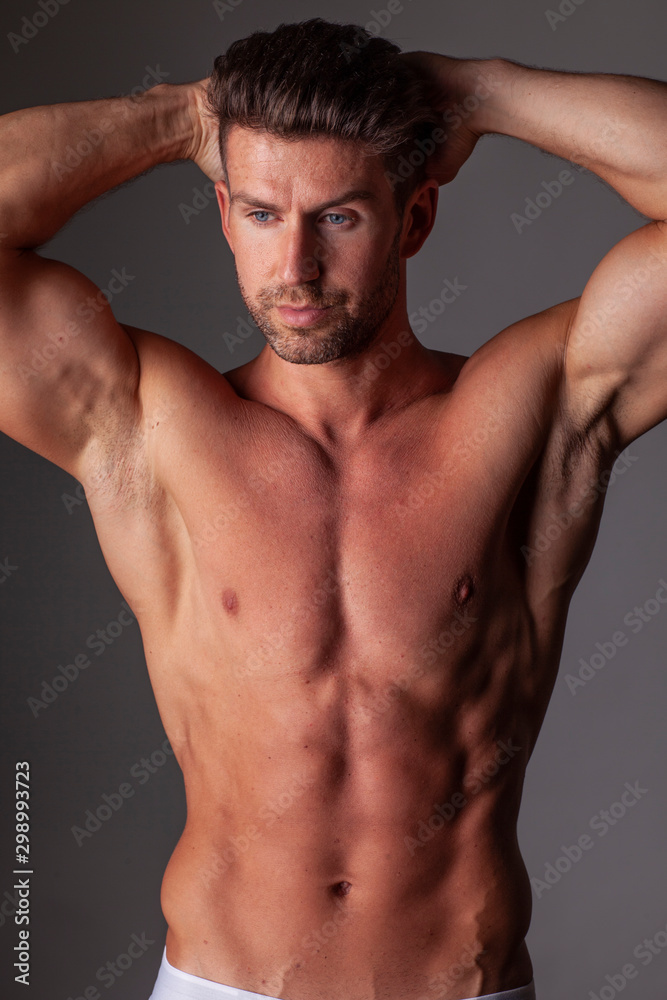 The portrait of muscular handsome model. The portrait of muscular handsome model.