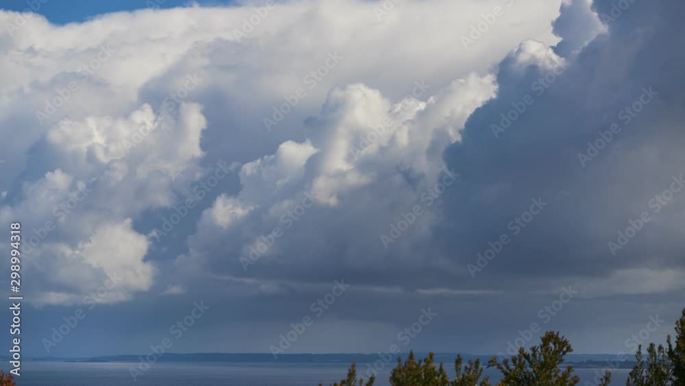 Time lapse of beautiful cloud formations over the sea during the day Time lapse of beautiful cloud formations over the sea during the day
