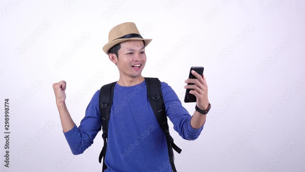 Asian Thai tourist live streaming video on social media with smart phone on white background Asian Thai tourist live streaming video on social media with smart phone on white background