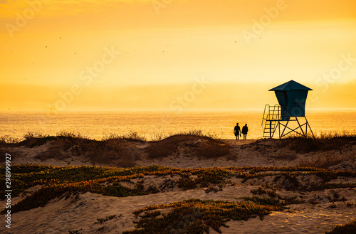 Romantic Couple at sunset on California Beach  © Don