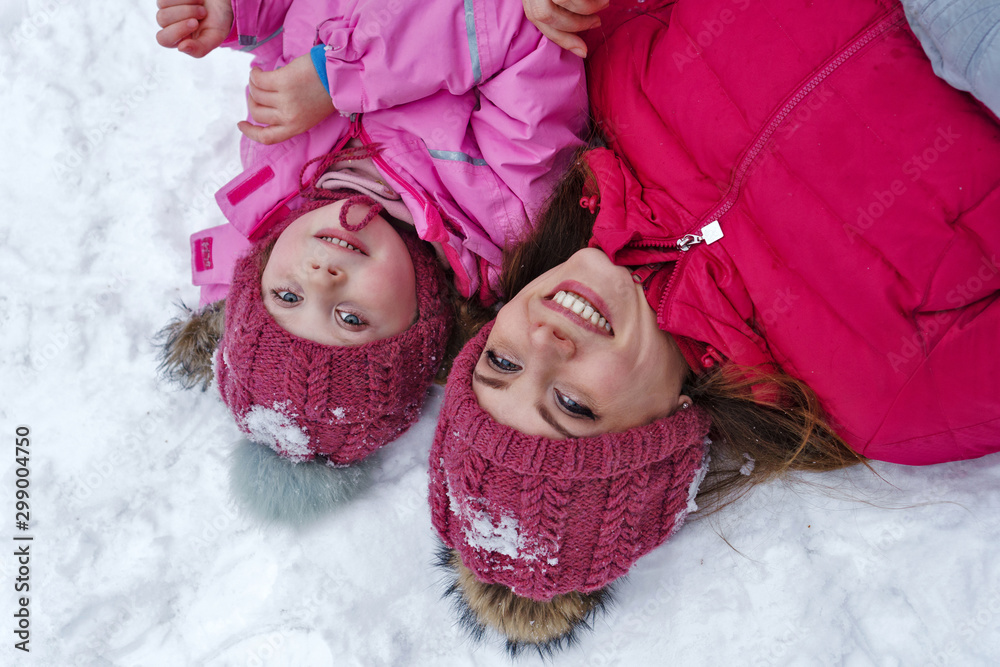 Fashionable stylish family having fun playing in snow. Weekends activities outdoor in cold weather. Winter fun family. Happiness to be parent. Family look. Lifestyle concept. Atmospheric moment. Fashionable stylish family having fun playing in snow. Weekends activities outdoor in cold weather. Winter fun family. Happiness to be parent. Family look. Lifestyle concept. Atmospheric moment.