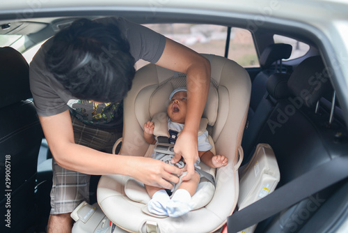 Cute little Asian baby boy sitting on Carseat photo