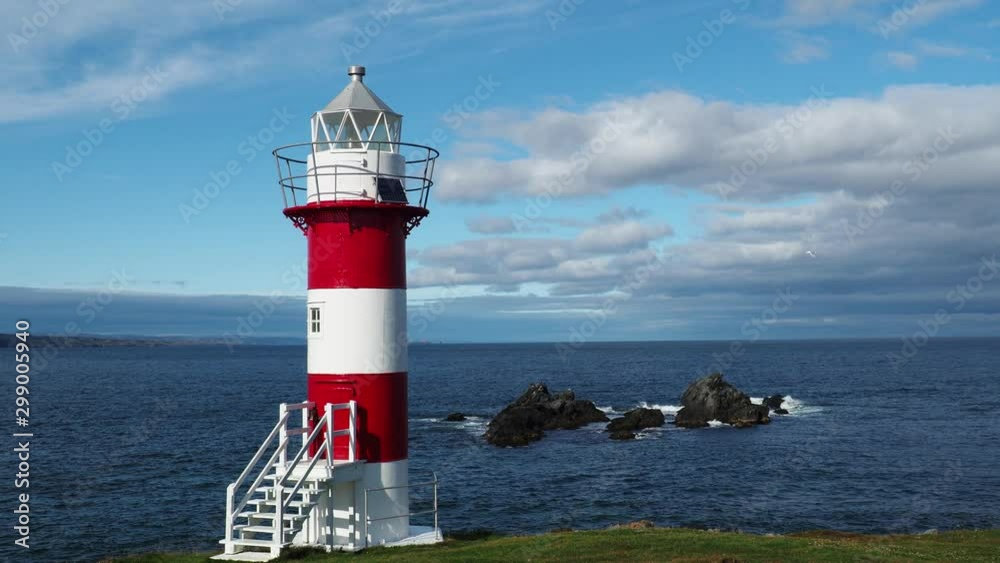 A light tower near a rocky outcrop along the coast of Newfoundland and Labrador. A light tower near a rocky outcrop along the coast of Newfoundland and Labrador.
