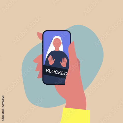 Hand holding a smartphone with a blocked user account, displayed on a screen, privacy in social media