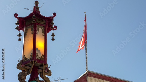 lamppost and flag in the chinatown district of san francisco