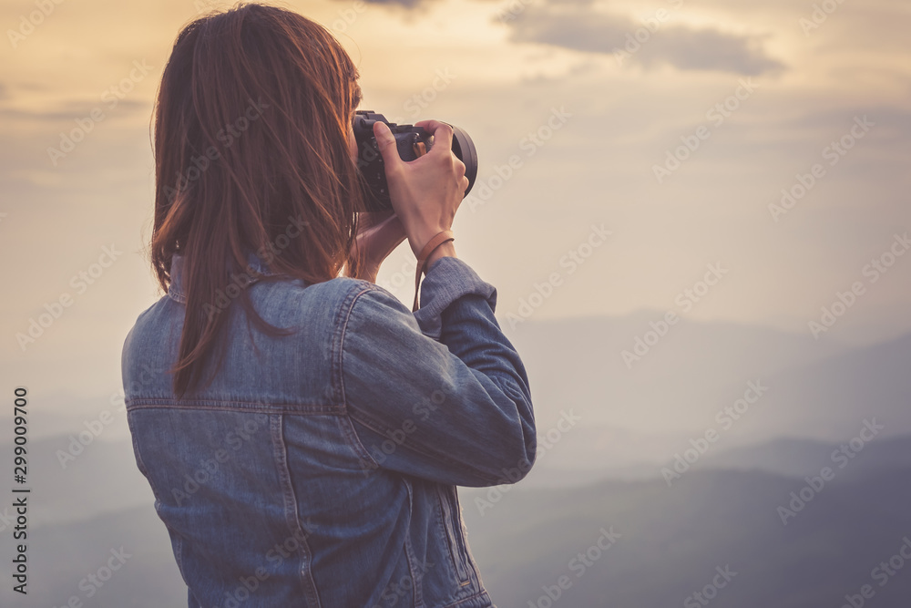 Young woman photographer taking photo view in Nan, Thailand. Travel concept. - obrazy, fototapety, plakaty 