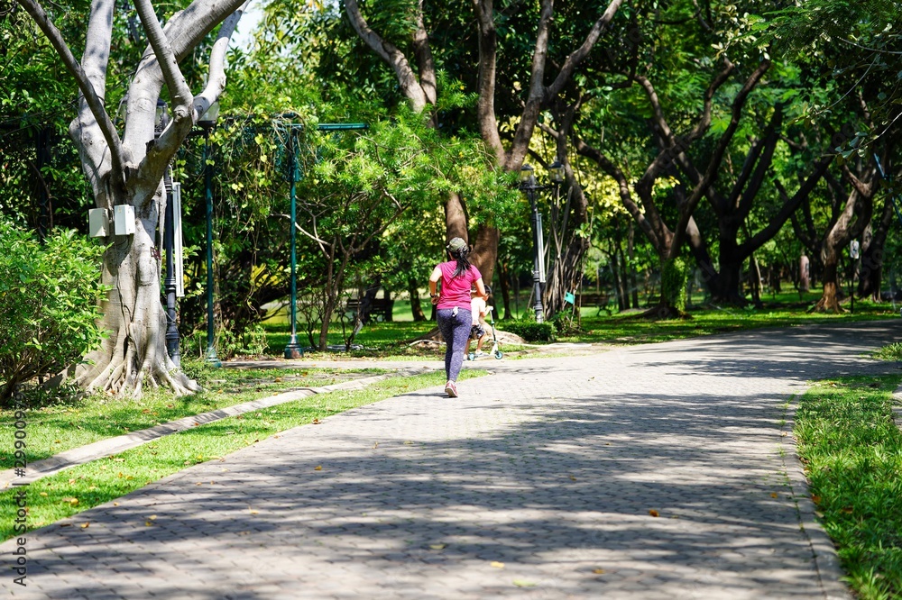 young woman riding a bicycle in the park