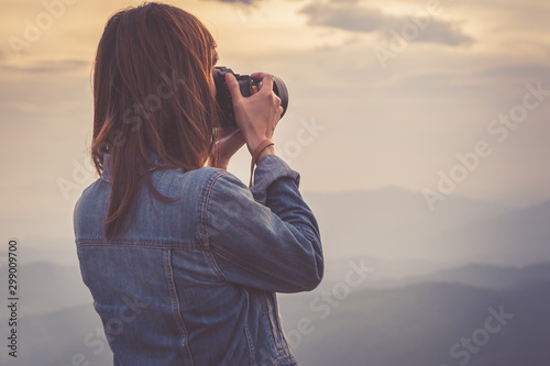 Young woman photographer taking photo view in Nan, Thailand. Travel concept.