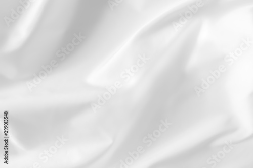 Abstract white fabric texture background. Cloth soft wave. Creases of satin, silk, and cotton.