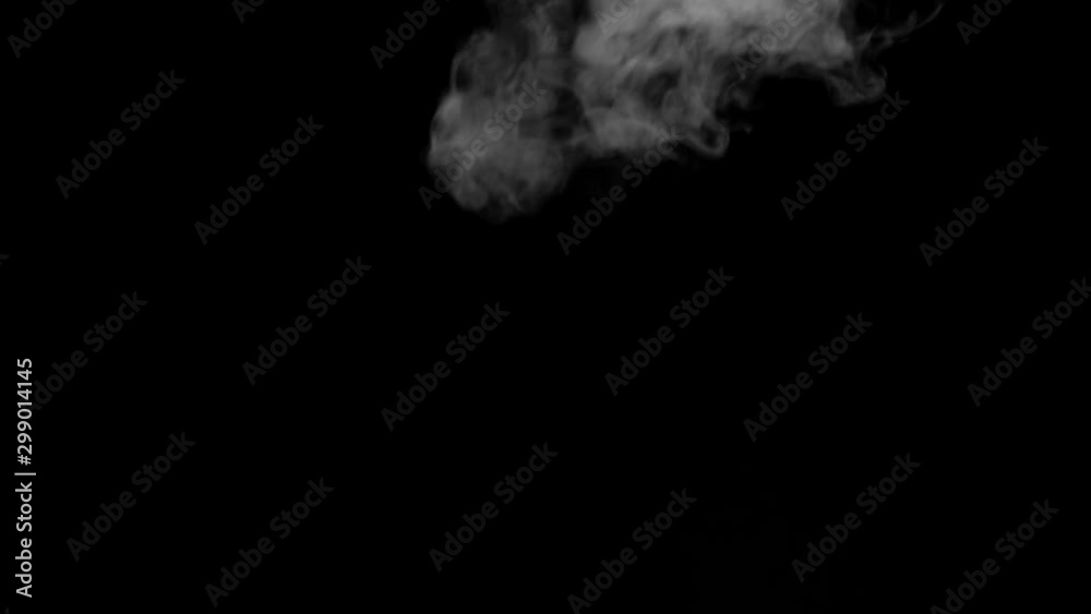 The smoke motion isolated on black background ,slow motion movement The smoke motion isolated on black background ,slow motion movement