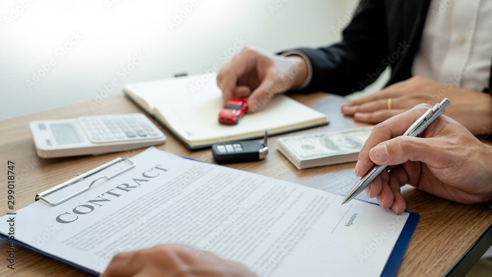 agent broker man holding document showing an transportation contract form to client ownership customer and salesman with car key. agent broker man holding document showing an transportation contract form to client ownership customer and salesman with car key.