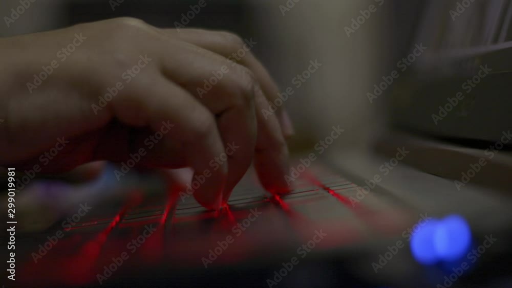 Hands of woman typing laptop keyboard during working hour on the desk at night. Hands of woman typing laptop keyboard during working hour on the desk at night.