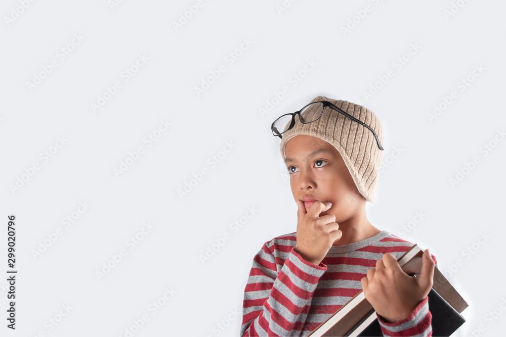 Cute boy thinking, A hand holding a books. Cute boy thinking, A hand holding a books.
