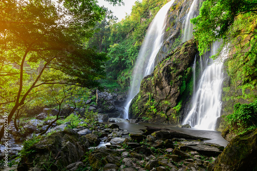 A beautiful waterfall deep in the tropical forest steep mountain adventure in the rainforest.