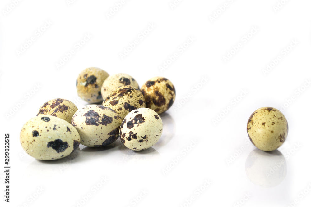 The gang, quail eggs on white background