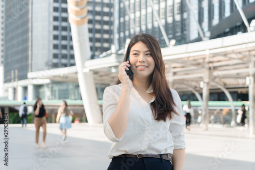 Professional business woman smiling calling smartphone urban city downtown