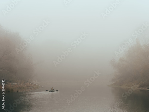 foggy morning fishermen on a boat on the water © makam1969