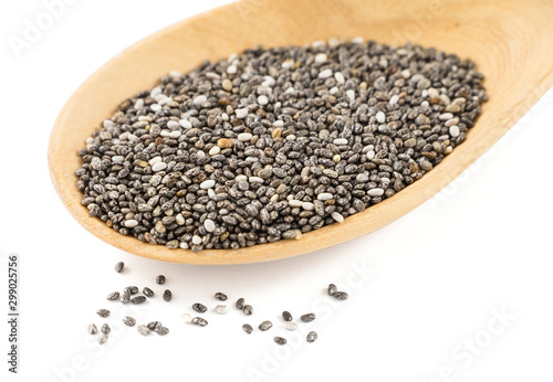 Close up of raw chia seed (super food) in wooden spoon isolated on white background