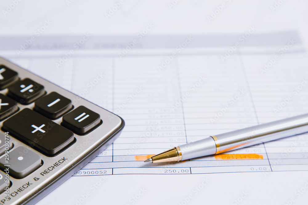 Spreadsheet bank accounts accounting with calculator.Concept for financial fraud investigation, audit and analysis. Spreadsheet bank accounts accounting with calculator.Concept for financial fraud investigation, audit and analysis.