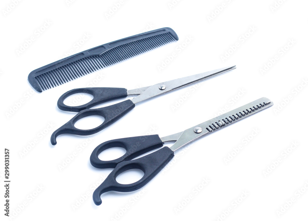 Comb with scissors on a white background Comb with scissors on a white background