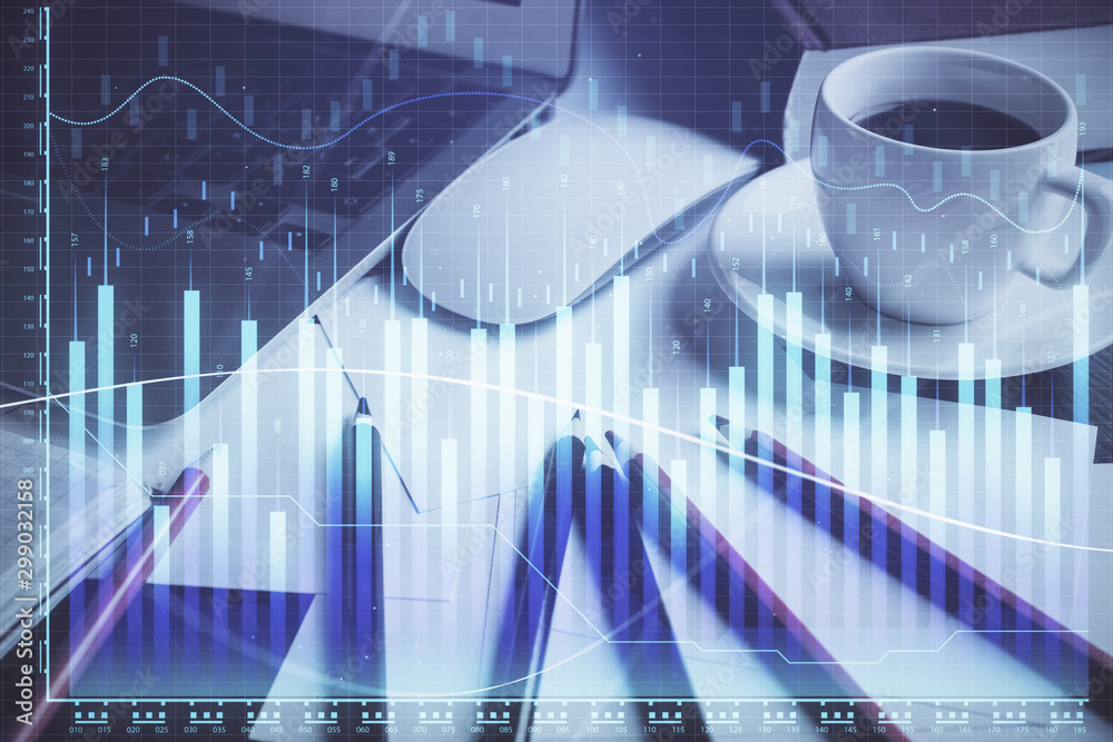 Forex market chart hologram and personal computer background. Multi exposure. Concept of investment. Forex market chart hologram and personal computer background. Multi exposure. Concept of investment.